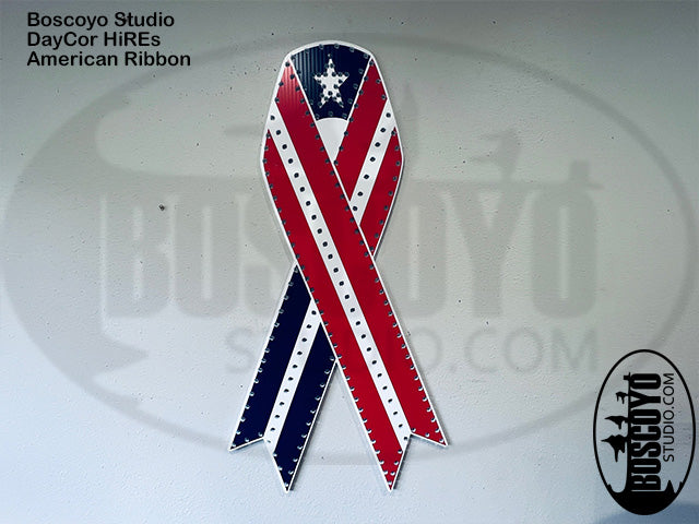 American flag-themed ribbon with 'Boscoyo Studio' branding on a blurred background