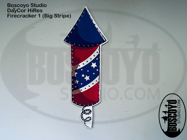 Firecracker-shaped sticker with American flag design on a white background, featuring Boscoyo Studio branding.